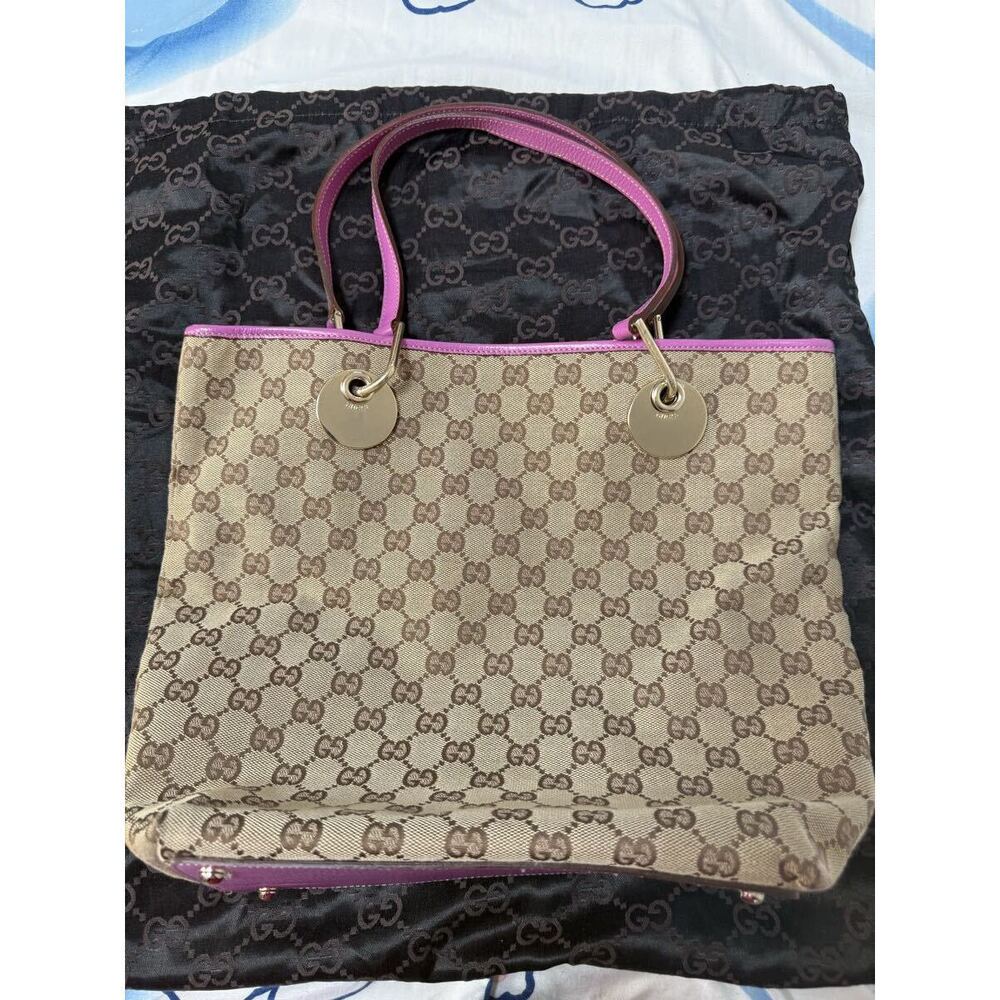 Gucci GG Canvas Eclipse Tote featuring pink leather